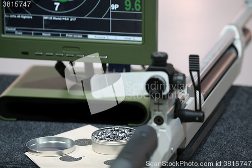 Image of air rifle and 10m target monitor