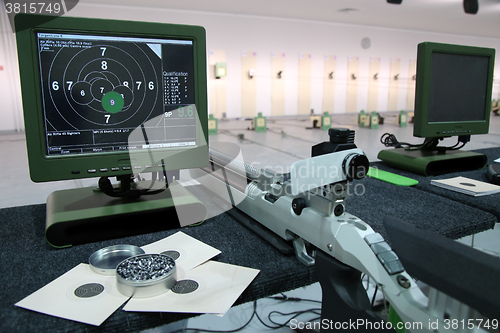 Image of air rifle and 10m target monitor