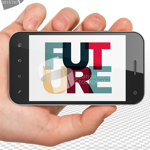 Image of Time concept: Hand Holding Smartphone with Future on  display