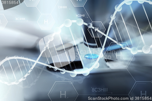 Image of close up of scientist hand with test sample in lab