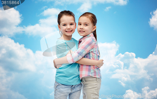 Image of happy smiling little girls hugging