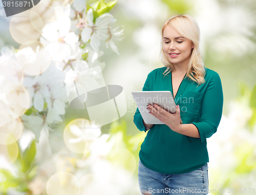 Image of smiling woman with tablet pc computer