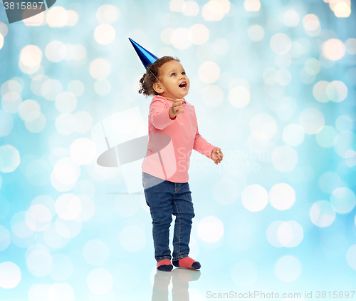 Image of happy little baby girl with birthday party hat