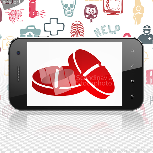 Image of Healthcare concept: Smartphone with Pills on display