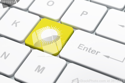 Image of Tourism concept: Sun on computer keyboard background