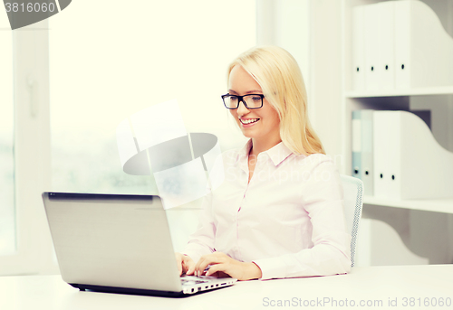 Image of smiling businesswoman or student with laptop