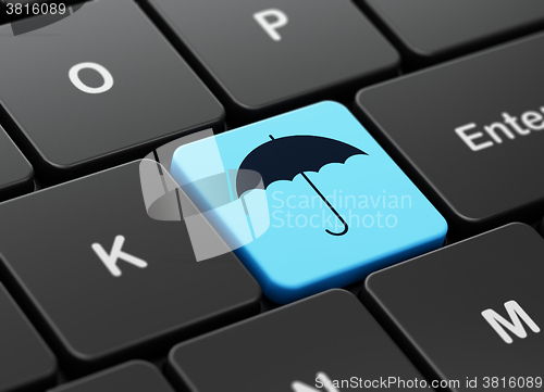 Image of Privacy concept: Umbrella on computer keyboard background