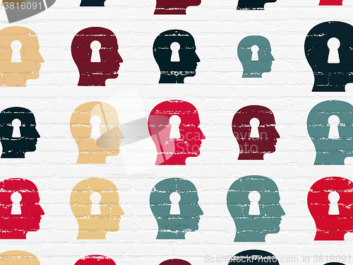 Image of Marketing concept: Head With Keyhole icons on wall background