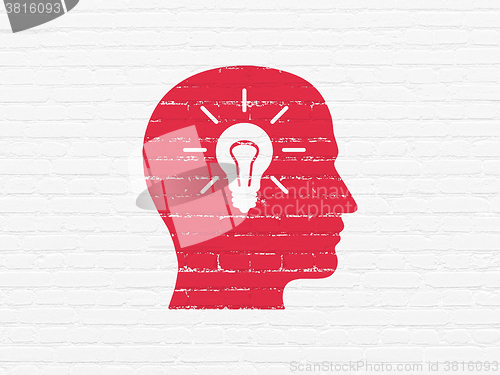 Image of Information concept: Head With Light Bulb on wall background