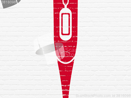 Image of Medicine concept: Thermometer on wall background