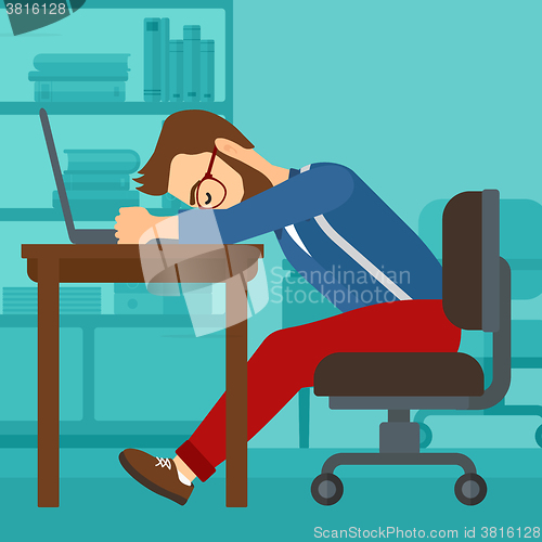 Image of Man sleeping on workplace.