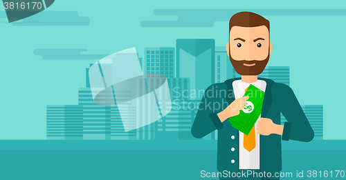 Image of Man putting money in pocket.