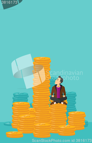 Image of Businessman sitting on gold.