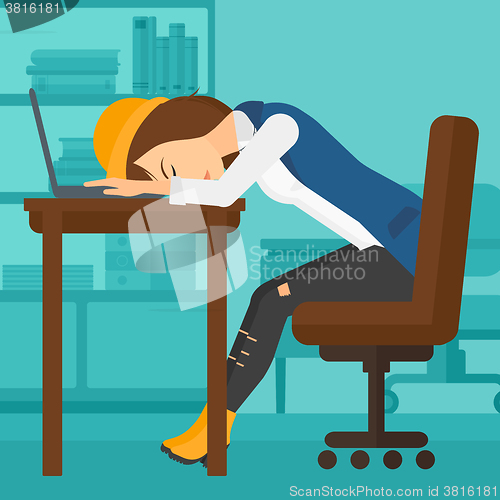 Image of Woman sleeping on workplace.