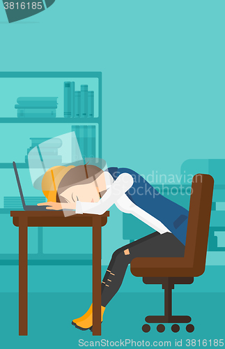 Image of Woman sleeping on workplace.