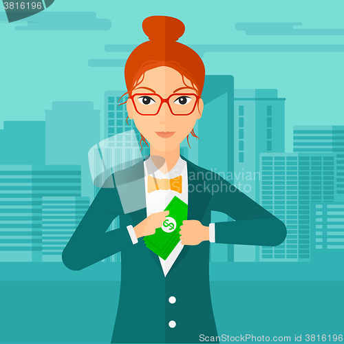 Image of Woman putting money in pocket.