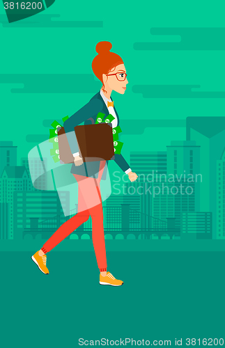 Image of Woman with suitcase full of money.