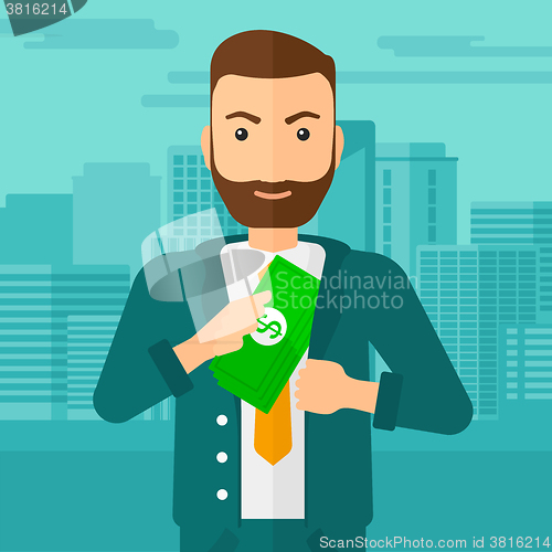 Image of Man putting money in pocket.