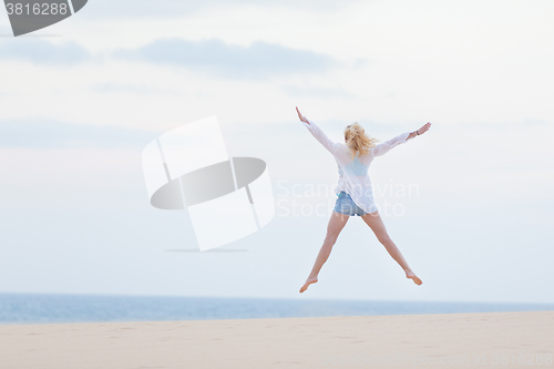 Image of Carefree woman enjoying freedom.