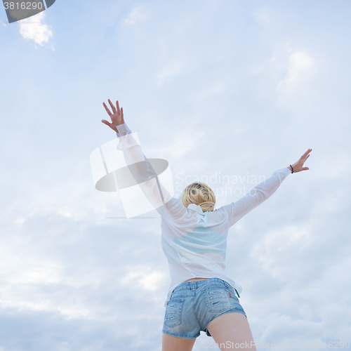 Image of Carefree woman enjoying freedom.