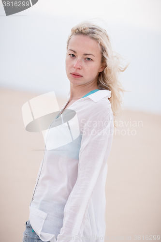 Image of Beautiful sensual girl alone at beach.