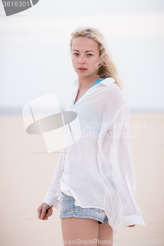 Image of Beautiful sensual girl alone at beach.