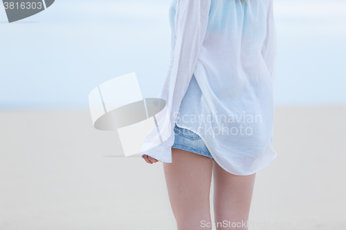 Image of Beautiful sensual girl alone at beach.