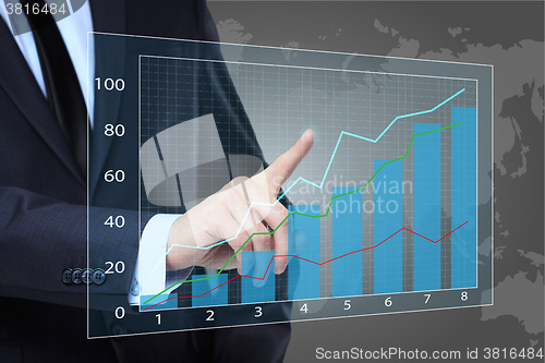 Image of Businessman Touching a Graph Indicating Growth. business concept 