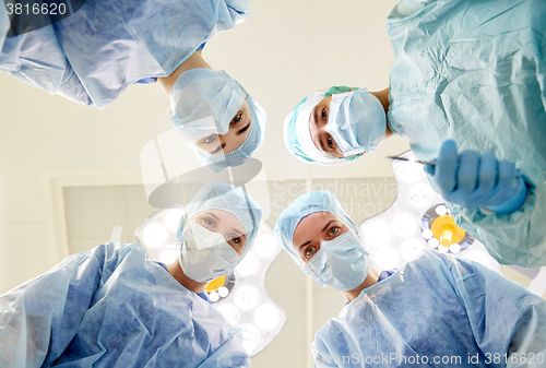 Image of group of surgeons in operating room at hospital