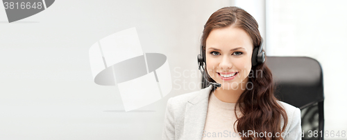 Image of helpline operator with laptop computer