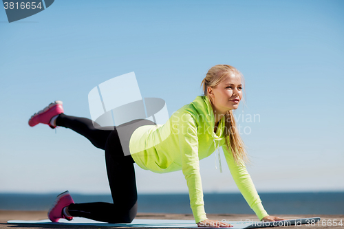 Image of woman doing sports outdoors