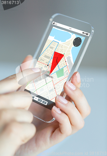 Image of close up of woman with gps navigator on smartphone