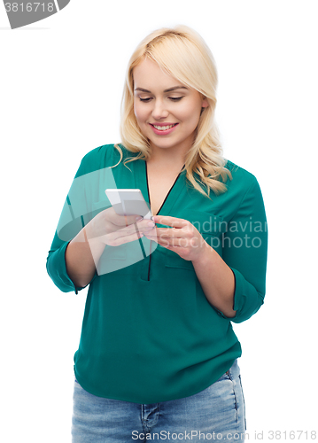 Image of happy woman with smartphone texting message