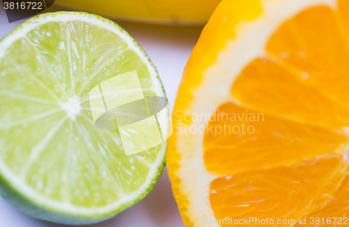 Image of close up of fresh juicy orange and lime