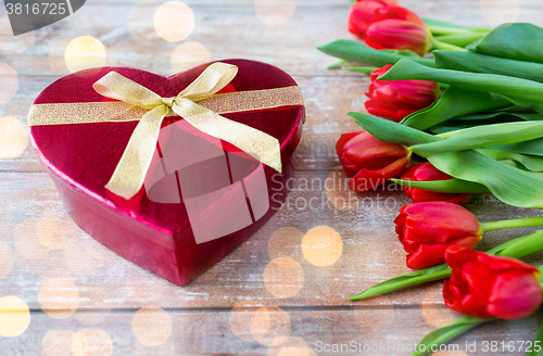 Image of close up of red tulips and chocolate box