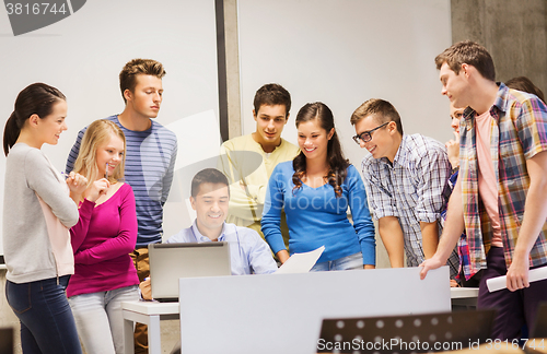 Image of group of students and teacher with laptop