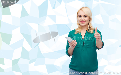 Image of happy woman with smartphone texting message