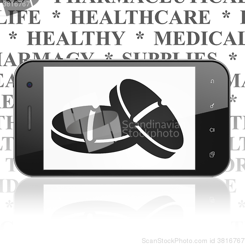Image of Health concept: Smartphone with Pills on display