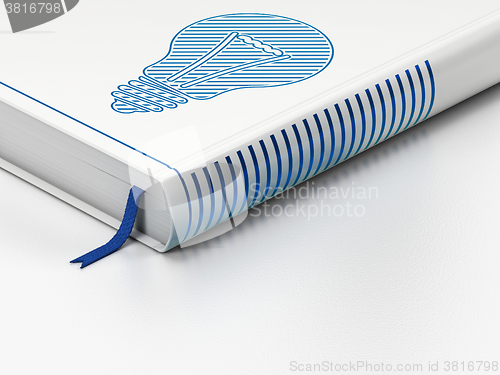 Image of Business concept: closed book, Light Bulb on white background