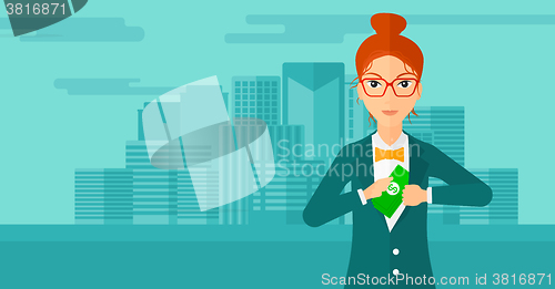 Image of Woman putting money in pocket.