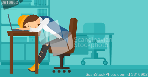 Image of Woman sleeping on workplace.