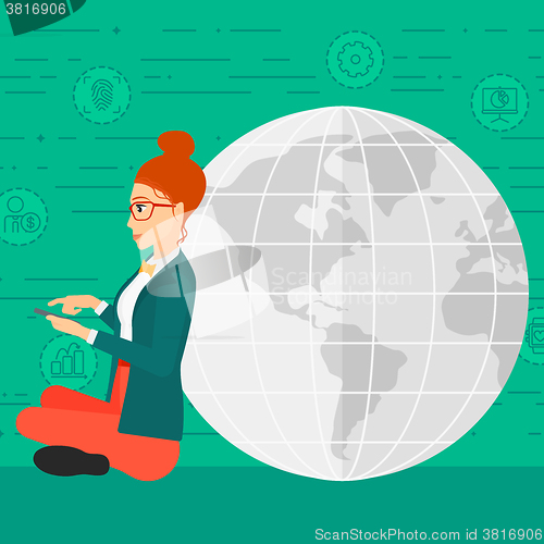 Image of Woman sitting near globe.