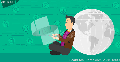 Image of Man sitting near globe.
