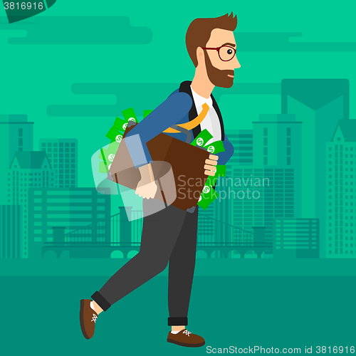 Image of Man with suitcase full of money.