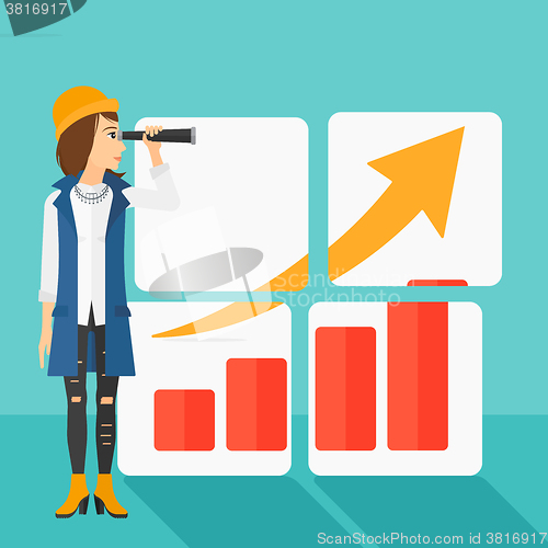 Image of Woman looking at positive bar chart.