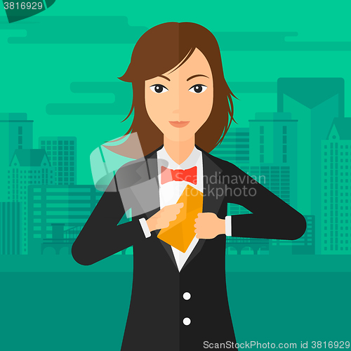 Image of Woman putting envelope in pocket.