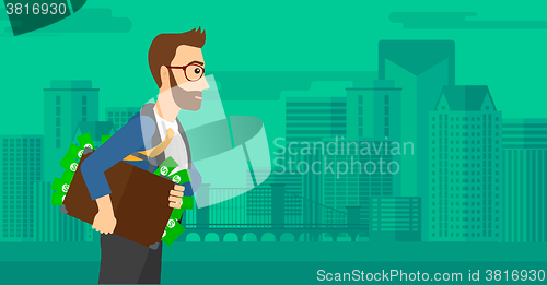 Image of Man with suitcase full of money.