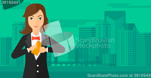 Image of Woman putting envelope in pocket.