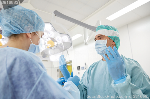 Image of surgeons in operating room at hospital