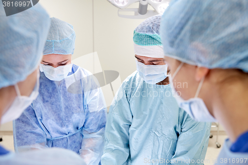 Image of group of surgeons in operating room at hospital